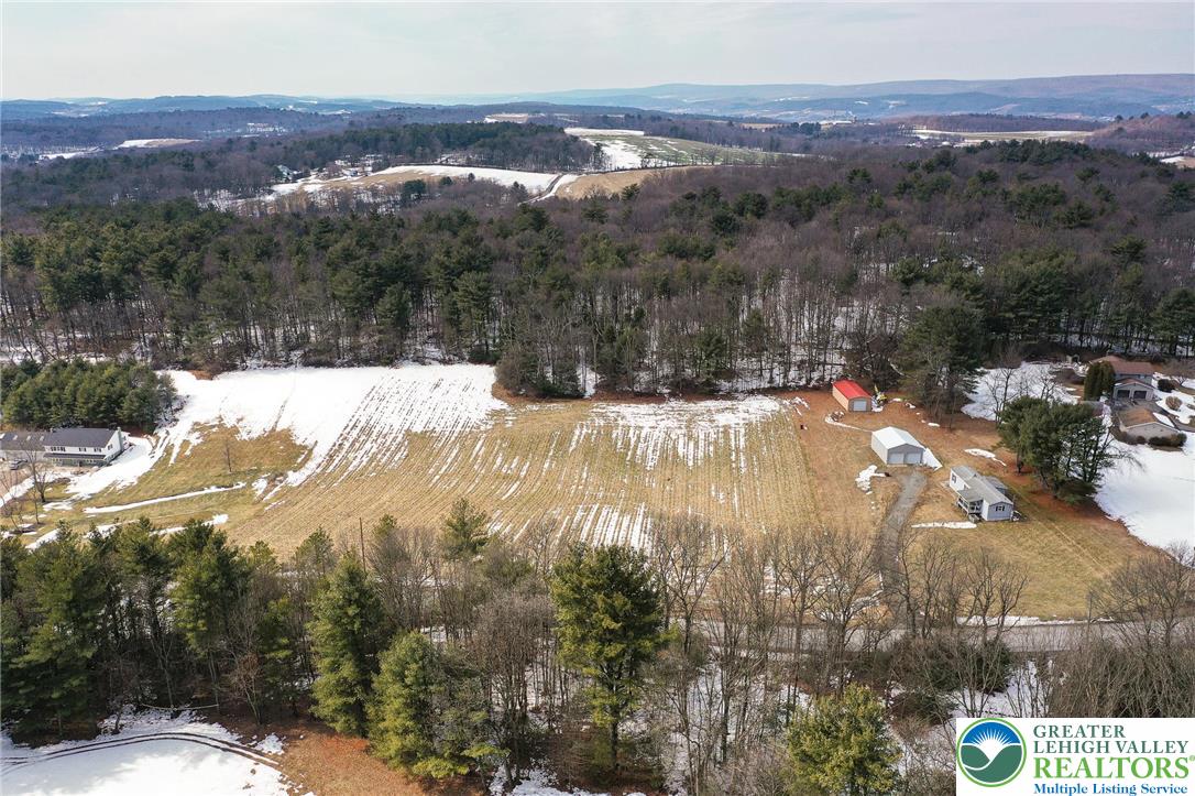 1115 Smithlane Road Lehighton, PA 18235 - Photo 8 of 24 a view of a yard from a lake