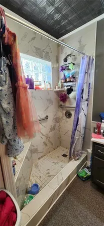 a white toilet sitting next to a bathroom sink