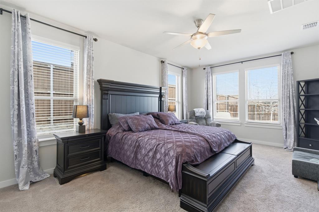 5613 Smt Crk Road Fort Worth, TX 76126 - Photo 16 of 40 a bedroom with a bed next to a window with a chandelier