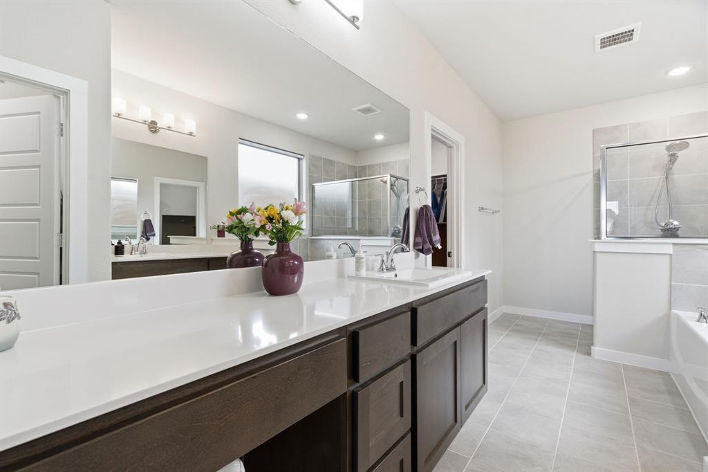5613 Smt Crk Road Fort Worth, TX 76126 - Photo 19 of 40 a bathroom with a sink double vanity and a mirror