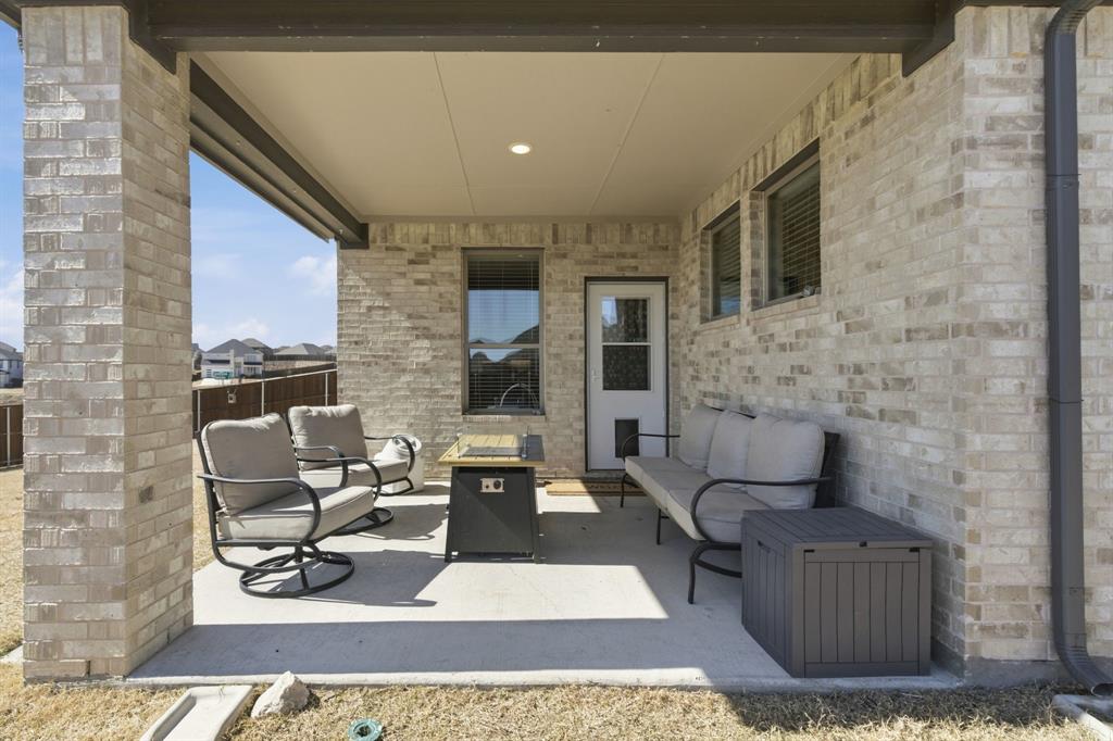 5613 Smt Crk Road Fort Worth, TX 76126 - Photo 34 of 40 a view of a patio with couches chairs and wooden floor
