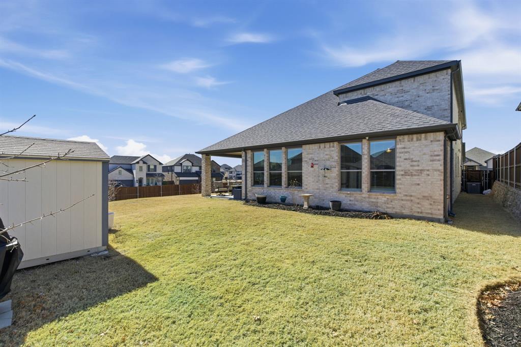 5613 Smt Crk Road Fort Worth, TX 76126 - Photo 37 of 40 a view of a house with a yard and garage