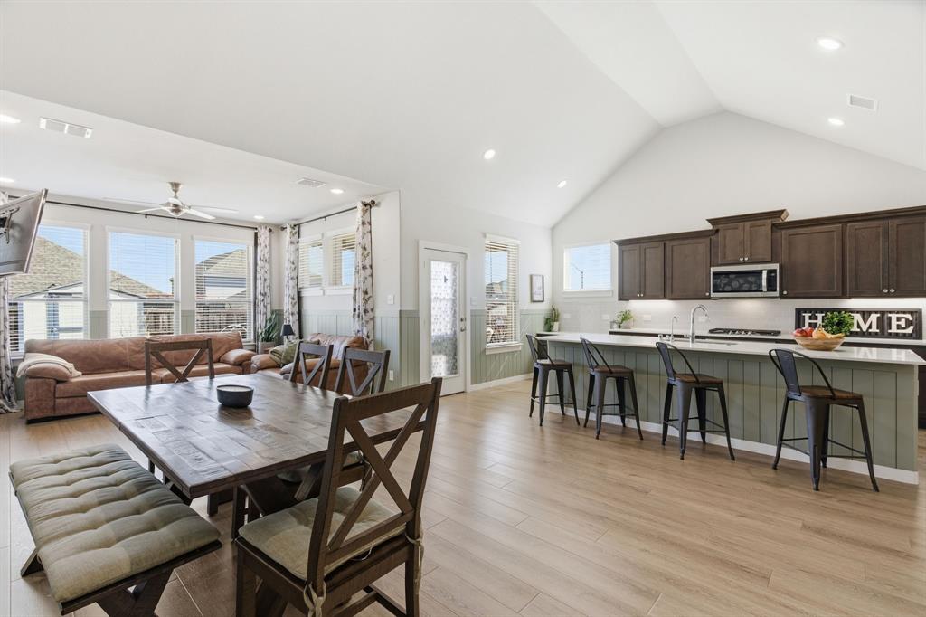 5613 Smt Crk Road Fort Worth, TX 76126 - Photo 5 of 40 a view of a dining room with furniture and wooden floor