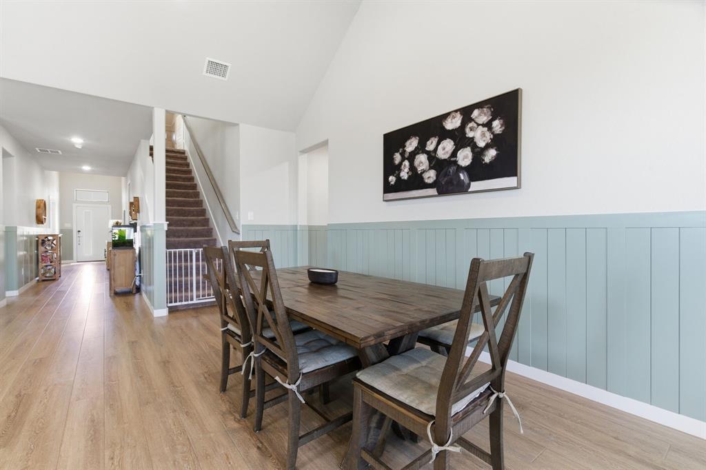 5613 Smt Crk Road Fort Worth, TX 76126 - Photo 7 of 40 a view of a dining room with furniture and wooden floor