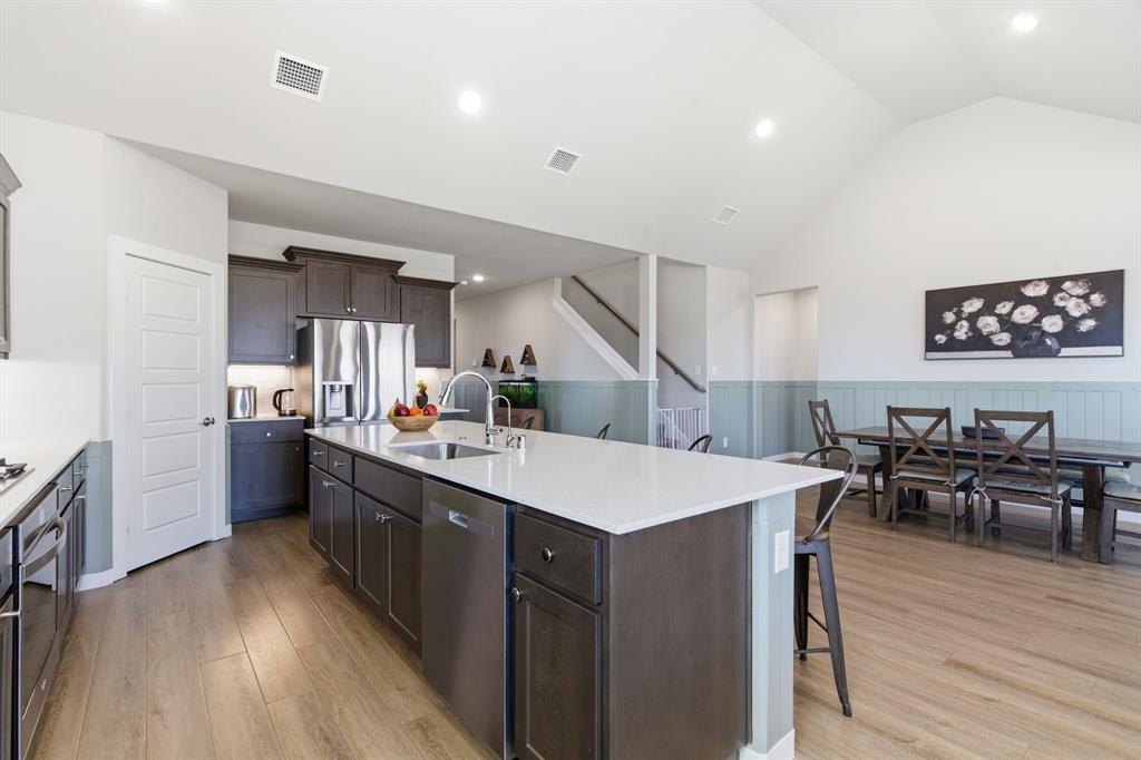 5613 Smt Crk Road Fort Worth, TX 76126 - Photo 10 of 40 a large kitchen with a table and chairs