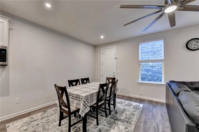 a dining room with furniture and window