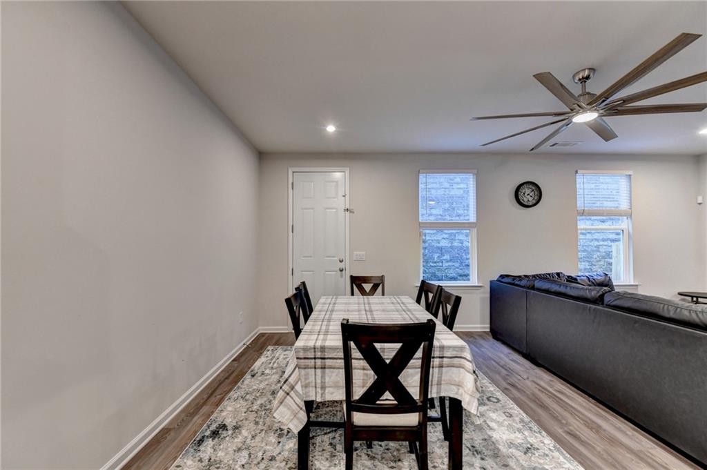 682 Smokey Quartz Way Kennesaw, GA 30144 - Photo 14 of 49 a dining room with furniture and window