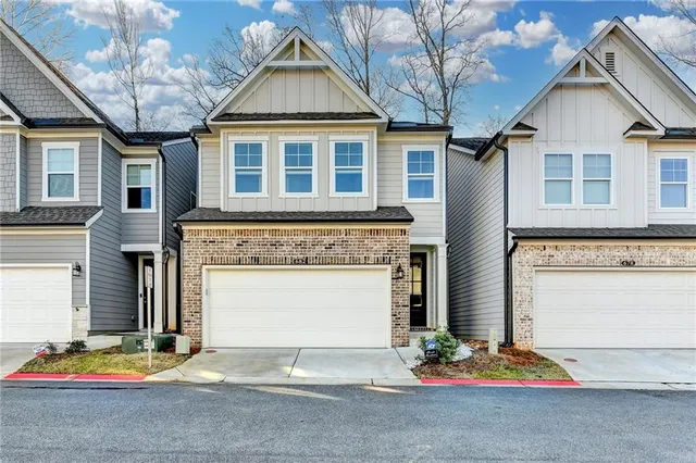 a front view of a house with a garage