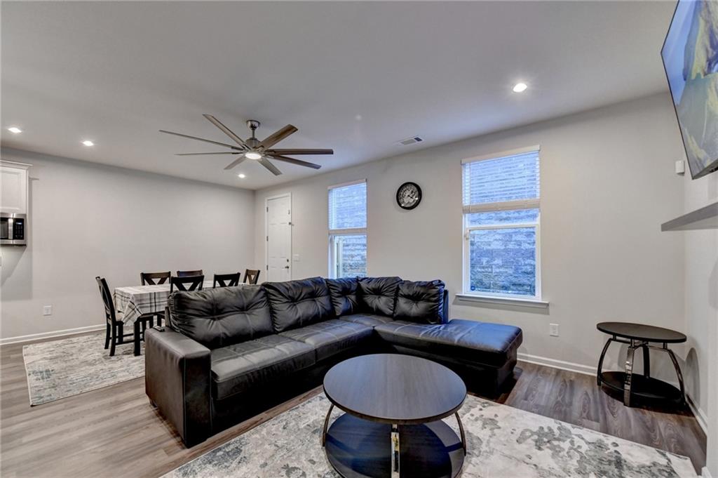 682 Smokey Quartz Way Kennesaw, GA 30144 - Photo 22 of 49 a living room with furniture and a table