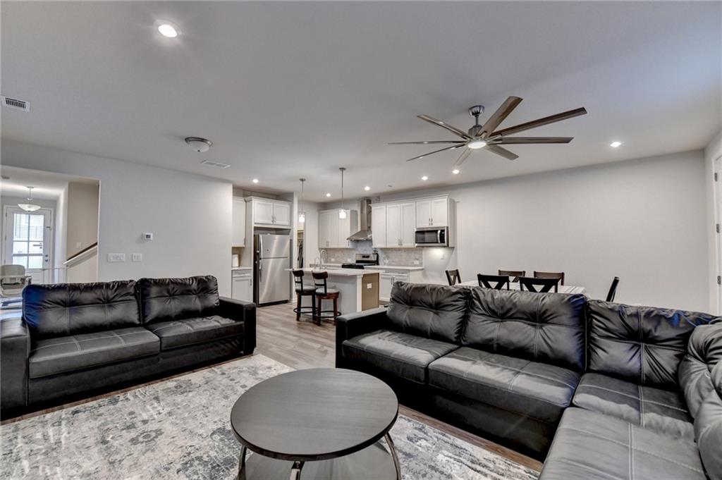 682 Smokey Quartz Way Kennesaw, GA 30144 - Photo 23 of 49 a living room with furniture