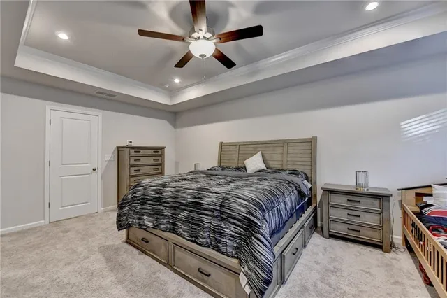 a bedroom with a bed and flat screen tv