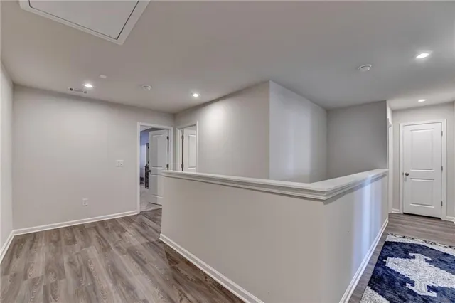 a bedroom with a bed and a lamp