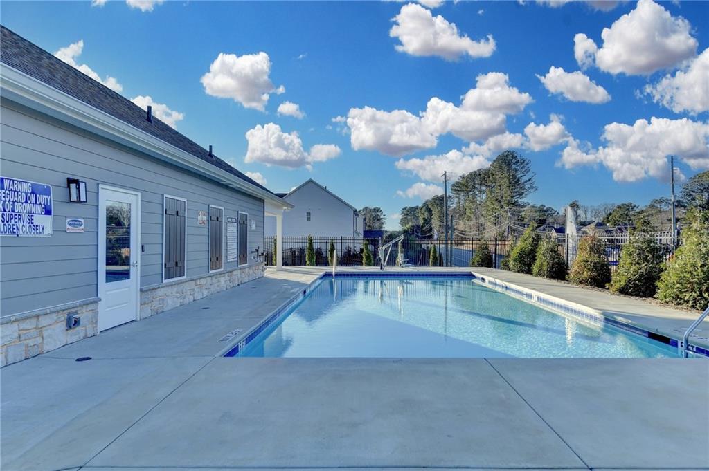 682 Smokey Quartz Way Kennesaw, GA 30144 - Photo 49 of 49 a view of a living room with kitchen