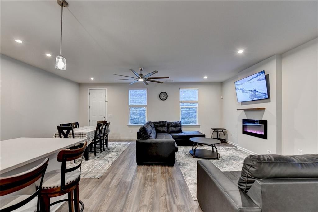 682 Smokey Quartz Way Kennesaw, GA 30144 - Photo 8 of 49 a living room with furniture and a wooden floor