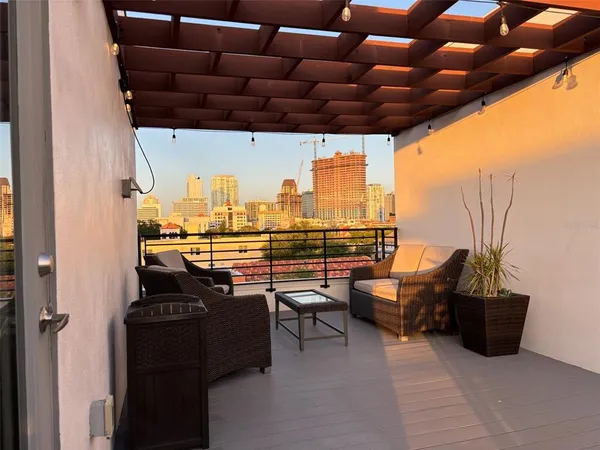 a view of balcony with furniture and outdoor space