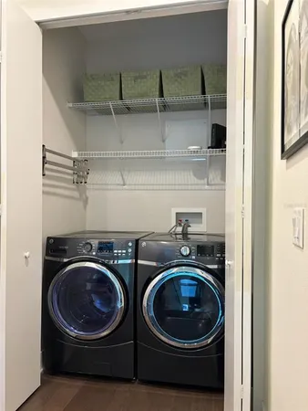 a utility room with sink dryer and washer