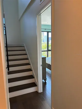 a view of entryway with wooden floor and windows