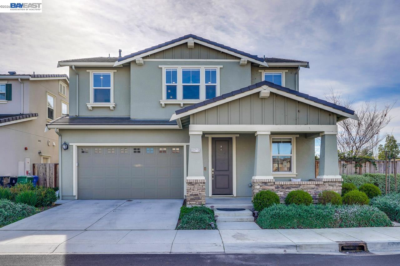a front view of a house with garage
