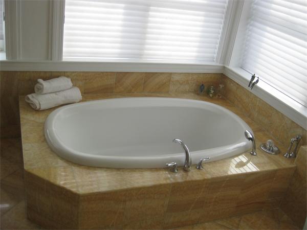 274 Dean Road Brookline, MA 02445 - Photo 17 of 25 a bath tub sitting in a bathroom next to a window