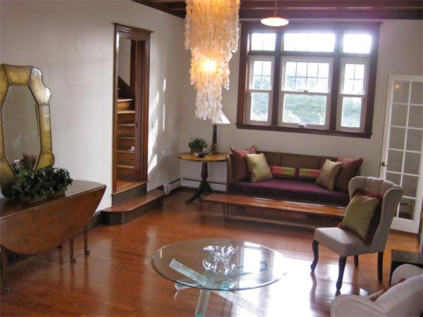 274 Dean Road Brookline, MA 02445 - Photo 3 of 25 a living room with furniture and a dining table