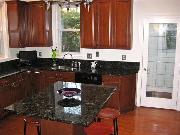 274 Dean Road Brookline, MA 02445 - Photo 10 of 25 a kitchen with stainless steel appliances granite countertop a stove a sink and a microwave