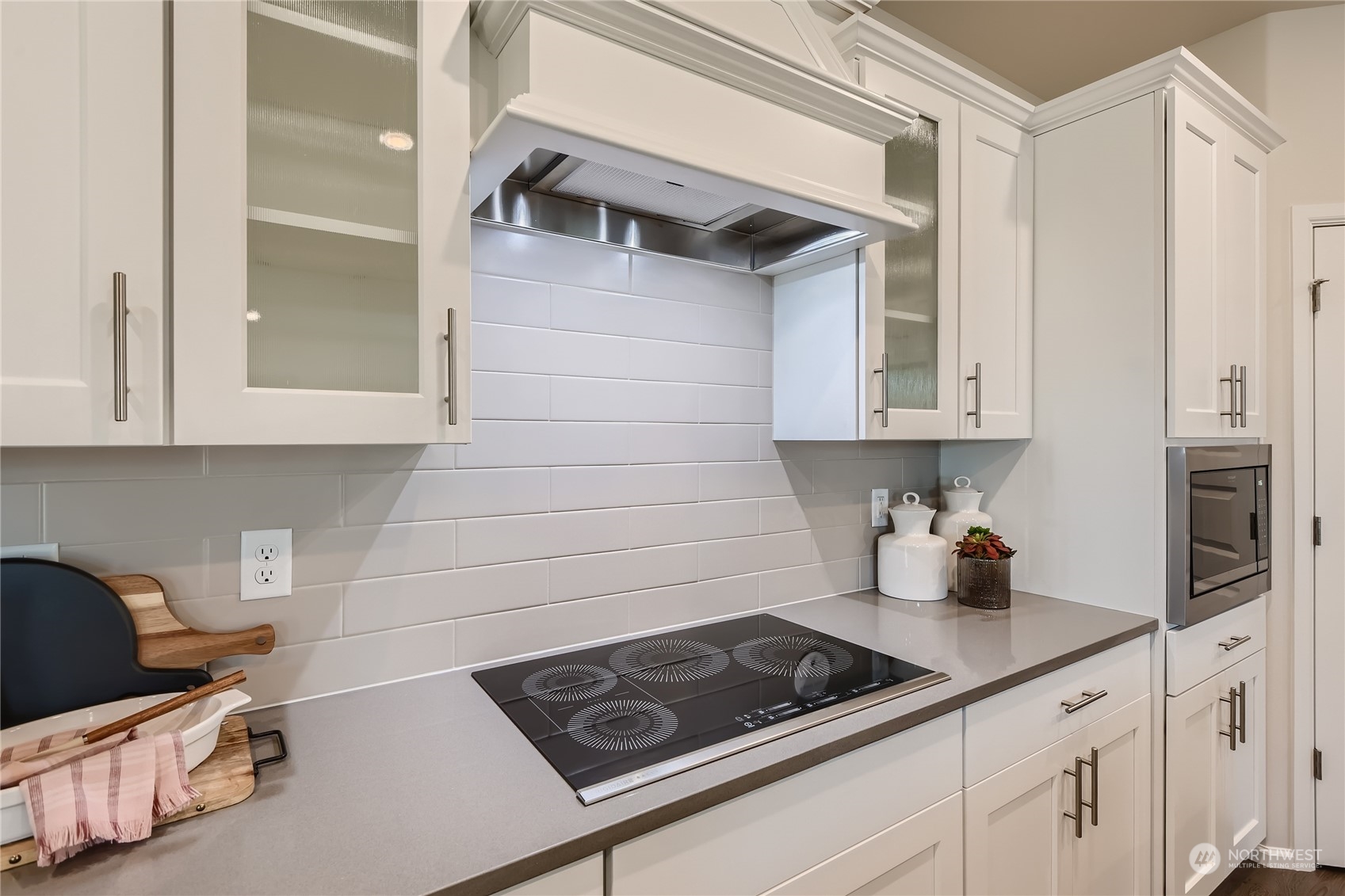 21005 42nd Avenue Southeast, Unit 112 Bothell, WA 98021 - Photo 10 of 24 a kitchen with stainless steel appliances a cabinets and a stove top oven