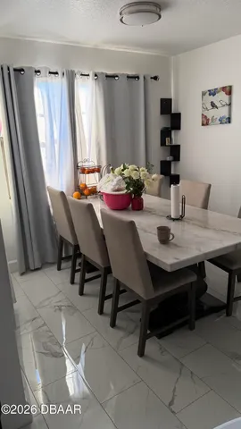 a view of a dining room with furniture
