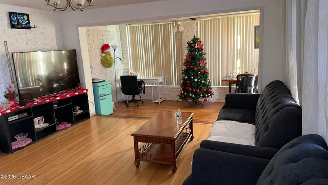 a living room with furniture and a flat screen tv