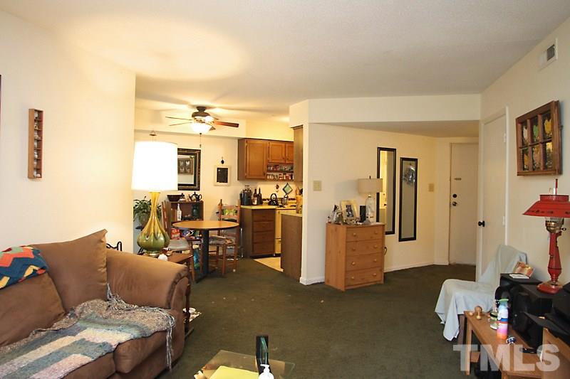 624 Pine Ridge Place, Unit 624 Raleigh, NC 27609 - Photo 16 of 16 Carpeted Living Room, Open Floor Plan. Easy flow to Dining, Kitchen, Patio, and Master Bedroom.