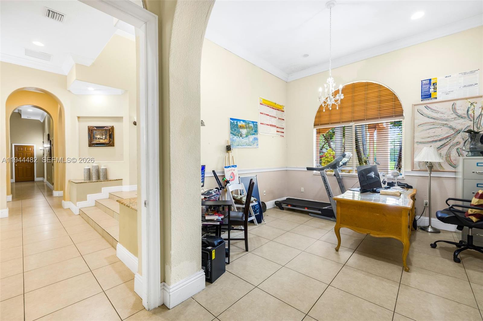 7761 Southwest 122nd Avenue Miami, FL 33183 - Photo 21 of 54 a living room with fireplace furniture and a table