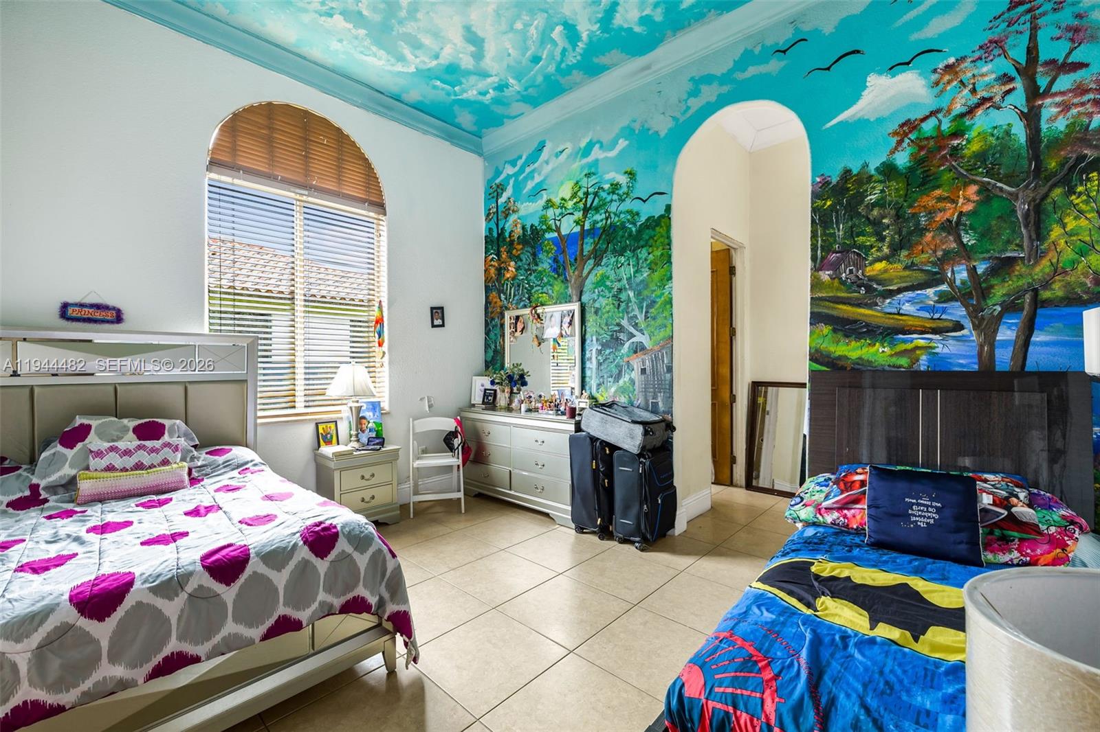 7761 Southwest 122nd Avenue Miami, FL 33183 - Photo 31 of 54 a bedroom with bed and a potted plant