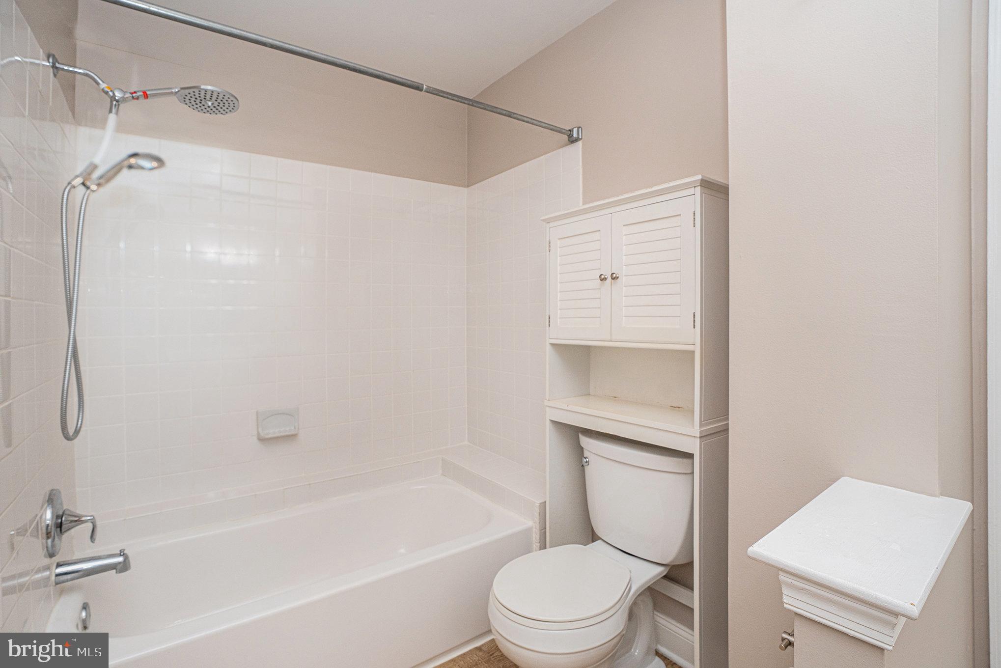 1042 Rafter Road Eagleville, PA 19403 - Photo 16 of 26 a bathroom with a toilet and a bathtub