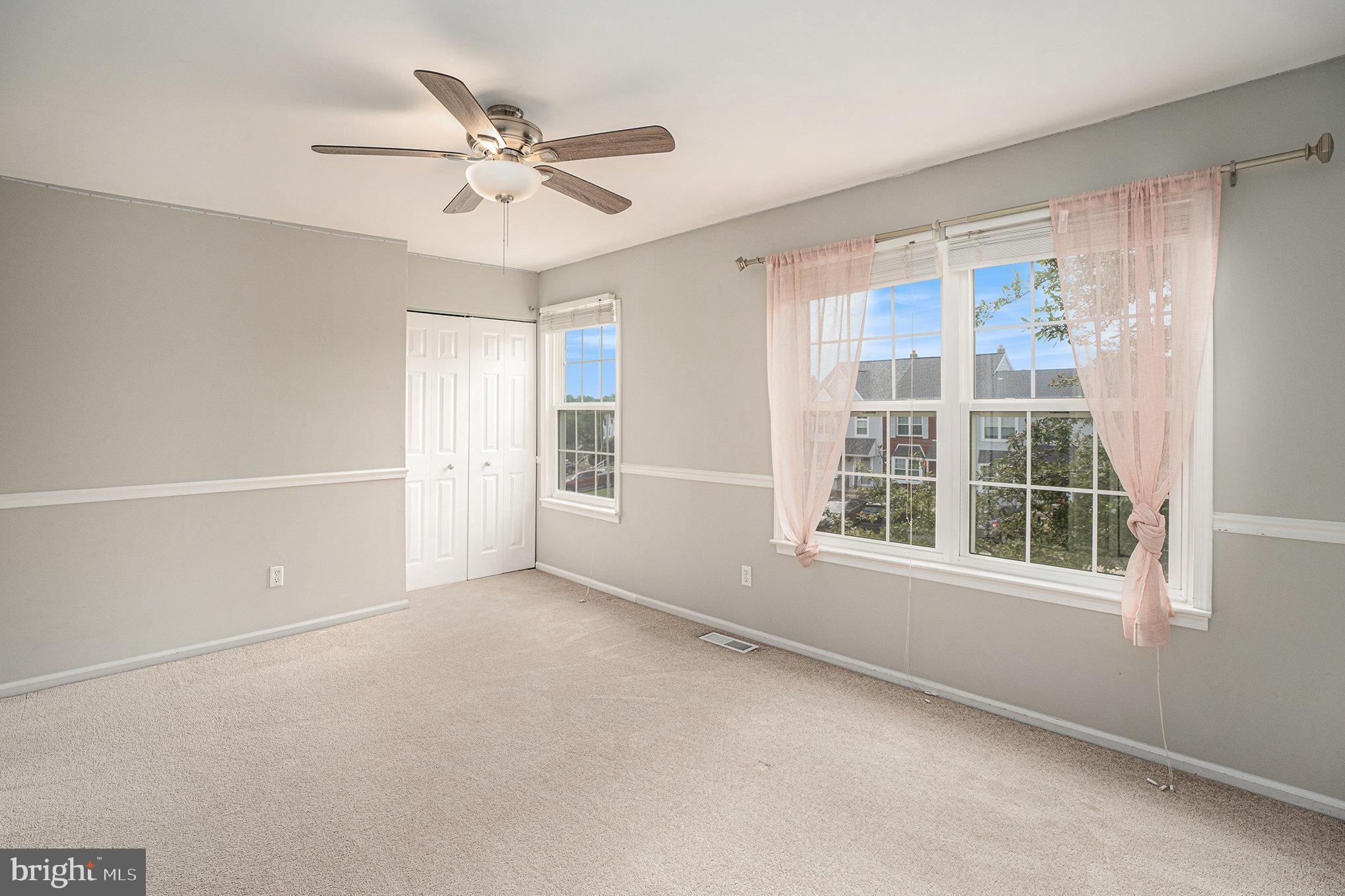 1042 Rafter Road Eagleville, PA 19403 - Photo 18 of 26 an empty room with window and ceiling fan