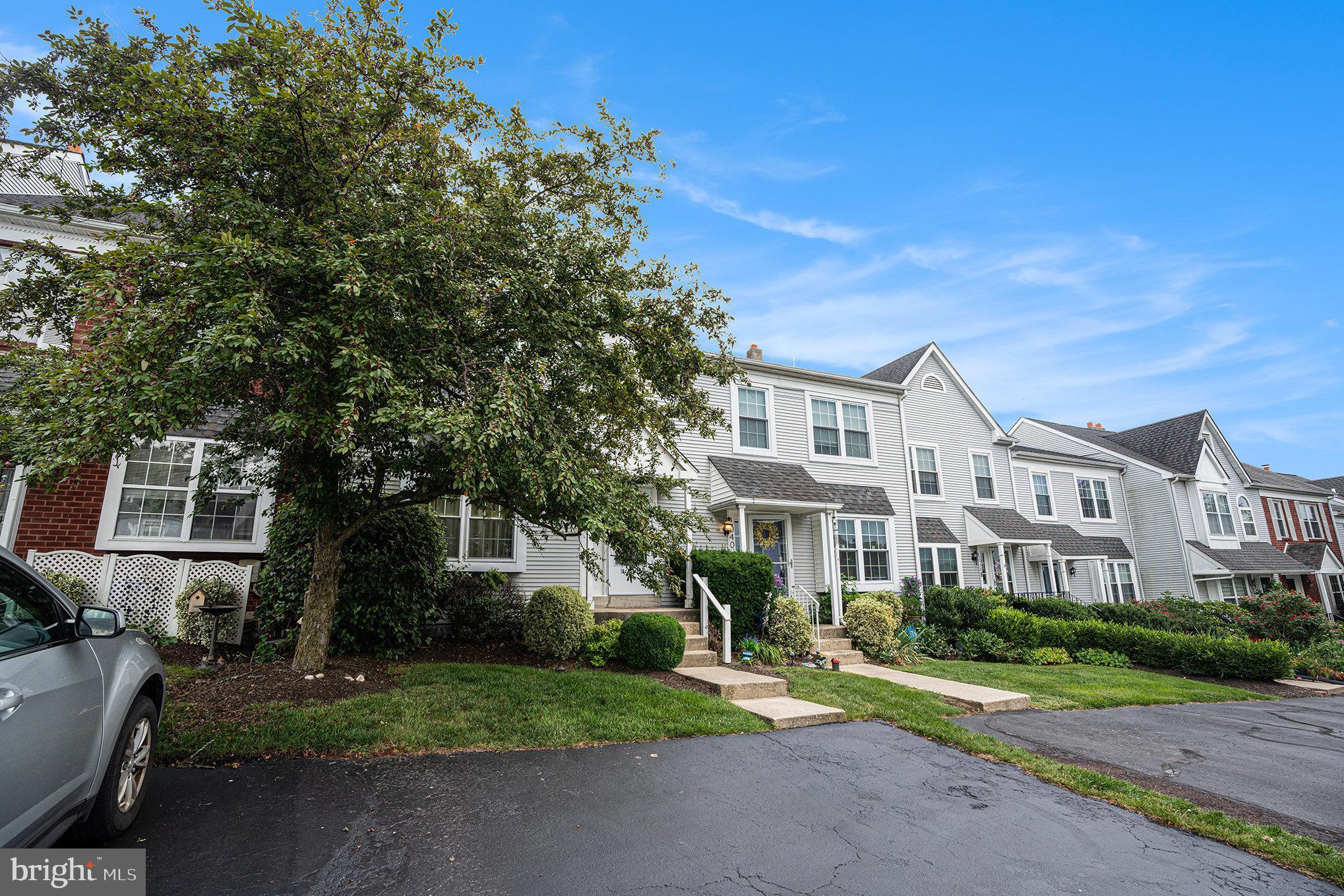 1042 Rafter Road Eagleville, PA 19403 - Photo 25 of 26 a front view of a house with a yard and garage