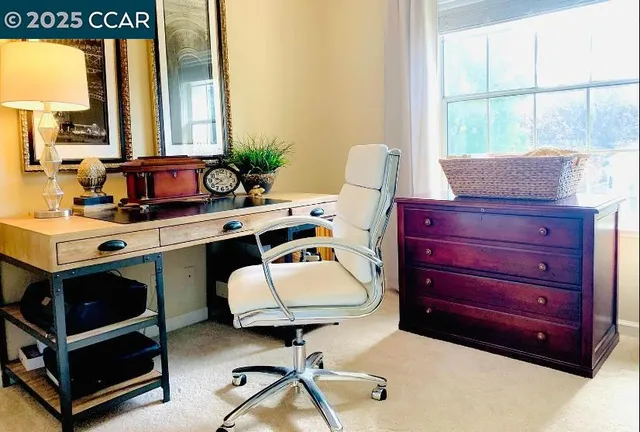 a room with a window bed and table