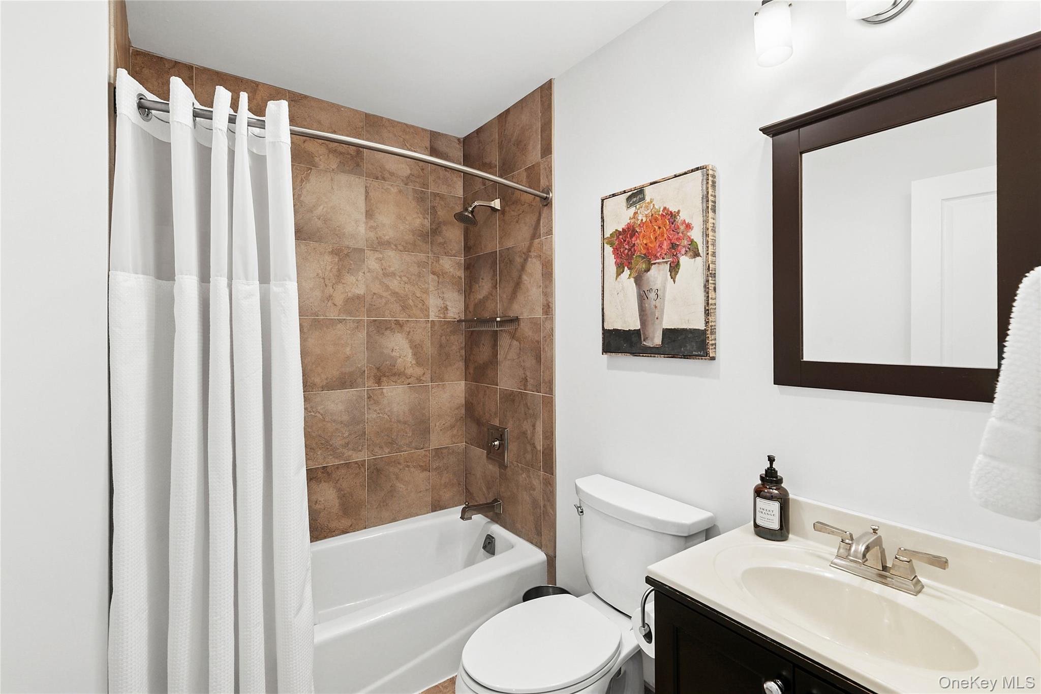 3470 North Bayview Road Southold, NY 11971 - Photo 14 of 25 Bathroom featuring vanity and shower / bathtub combination