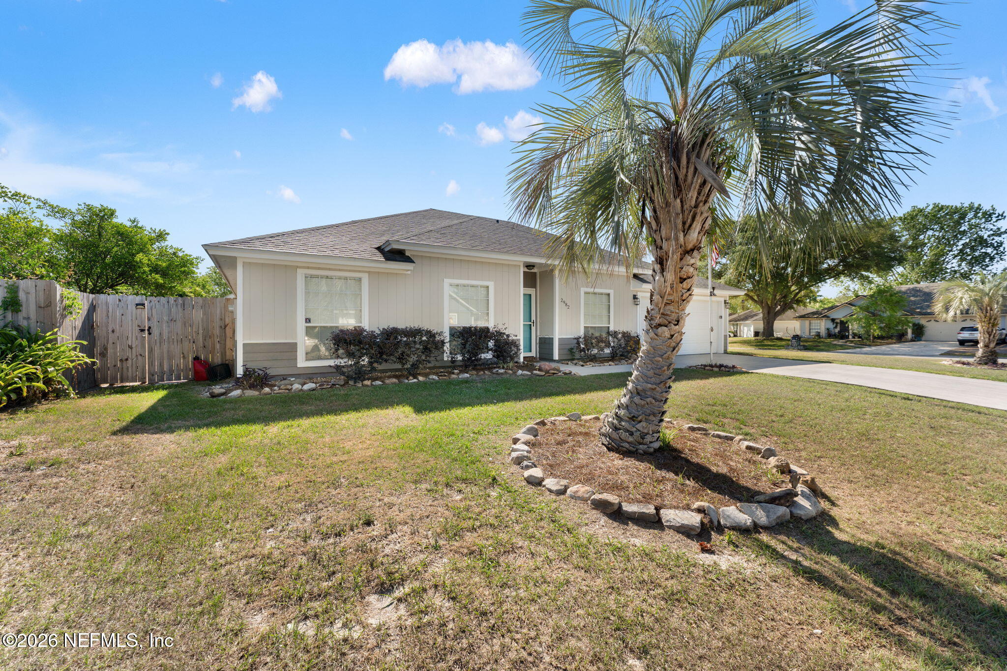 2982 Chief Ridaught Trail Middleburg, FL 32068 - Photo 3 of 29 a front view of a house with garden