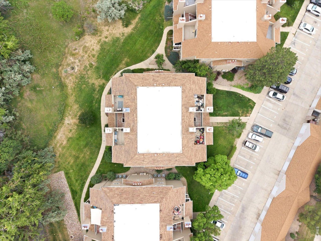 4945 Twin Lakes Road, Unit 46 Boulder, CO 80301 - Photo 35 of 42 showcasing the building's prime position backing to open space and scenic trails. Community pool, fitness center, and clubhouse complete the easy, lock-and-leave lifestyle.
