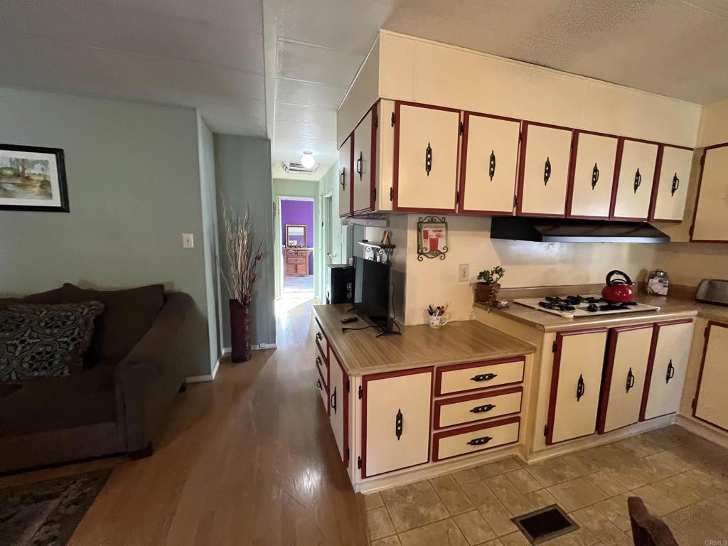1810 Hillsdale Road, Unit 99 El Cajon, CA 92019 - Photo 4 of 15 a kitchen that has a lot of cabinets in it