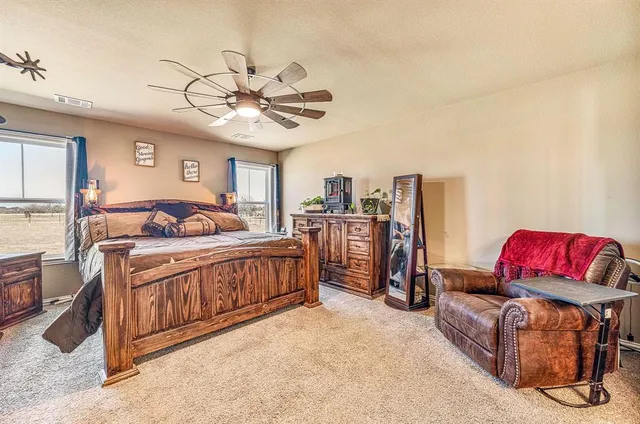 a bedroom with furniture and a chandelier