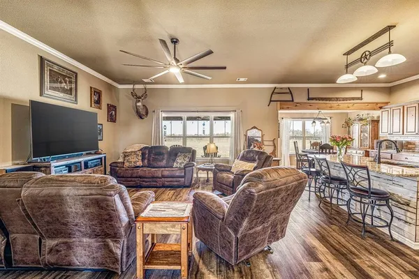 a living room with fireplace furniture and a flat screen tv