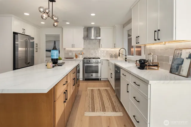 a kitchen with cabinets a sink and appliances