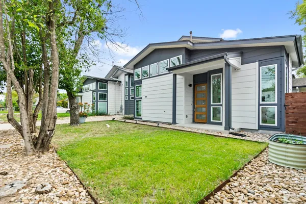 a view of a house with a yard