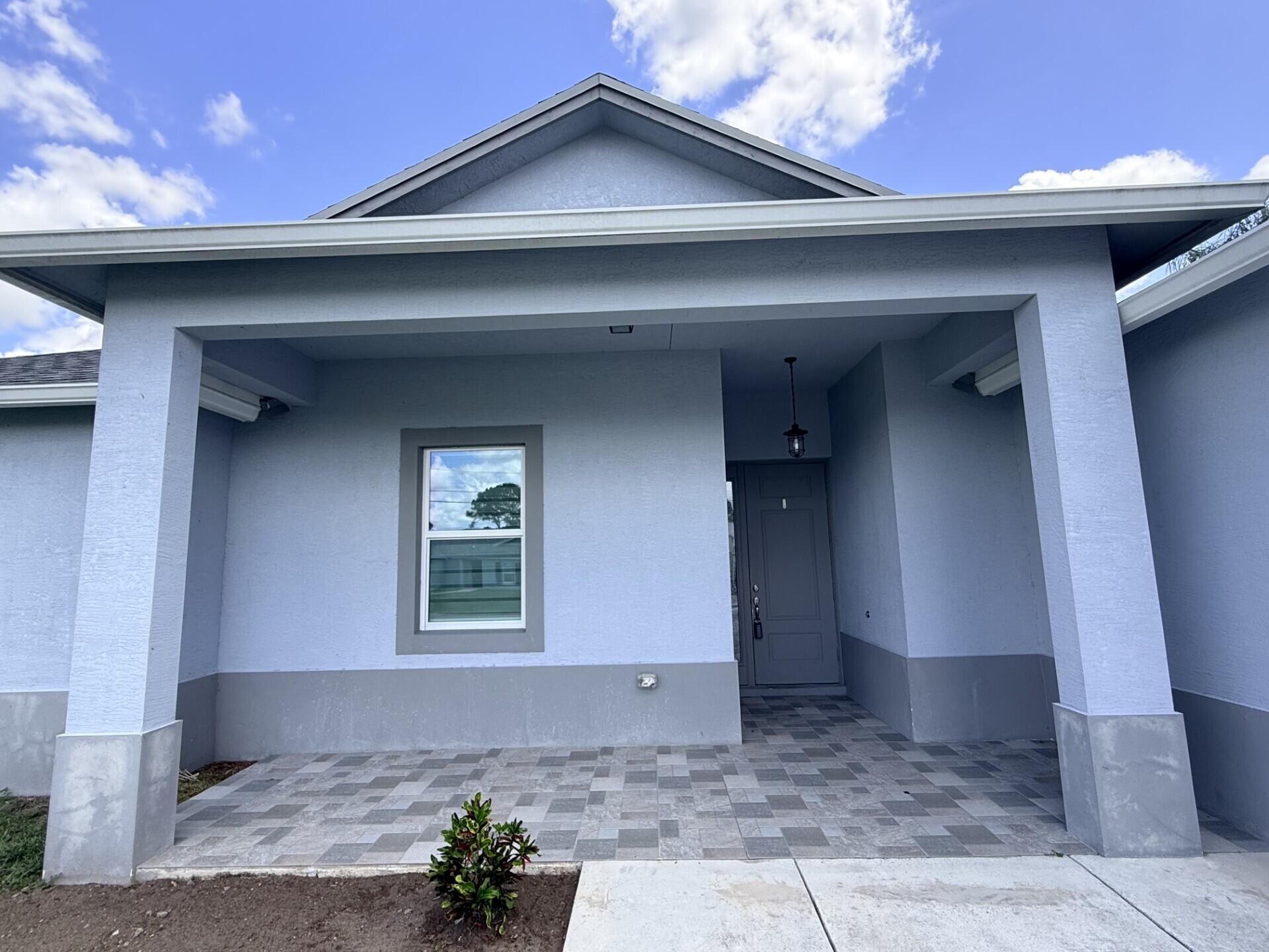 5673 Northwest Whitecap Road Port St. Lucie, FL 34986 - Photo 3 of 31 ad01b34d-a033-4f63-a259-1189ba3aa3ea