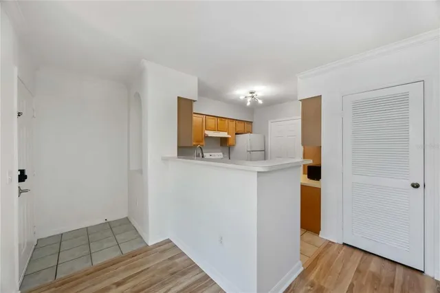a view of kitchen with wooden floor