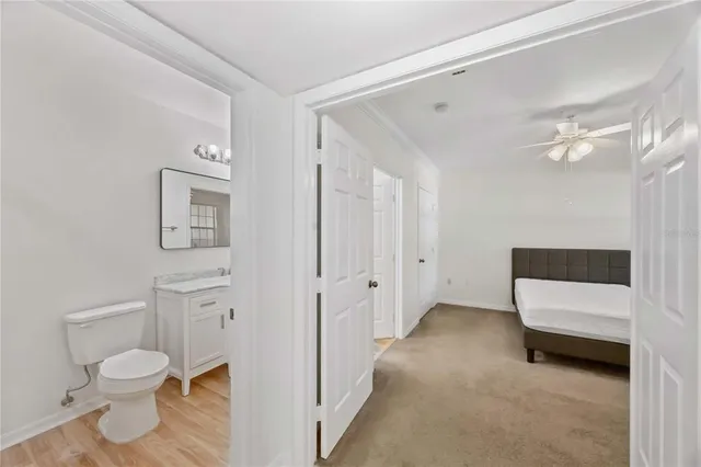 a spacious bathroom with a toilet and a shower