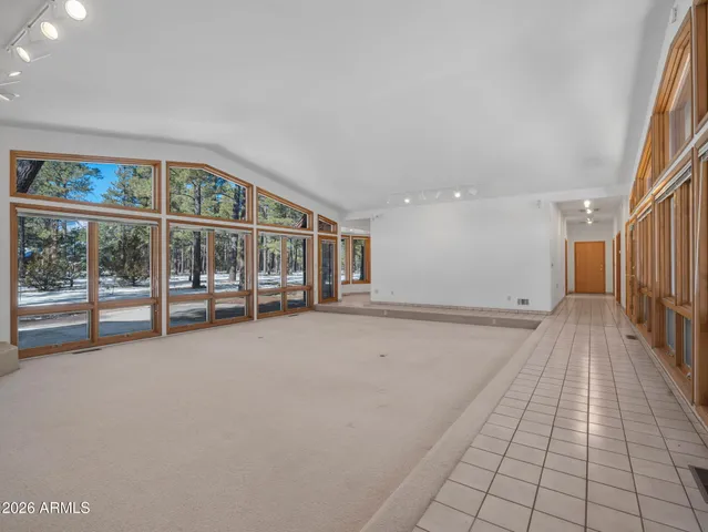 a view of livingroom with furniture and floor to ceiling window