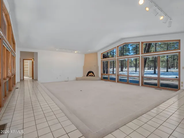 a view of an empty room with glass door