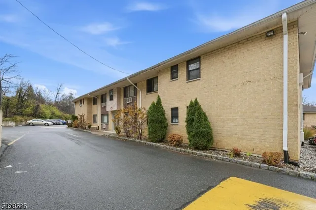 a view of a house with a street