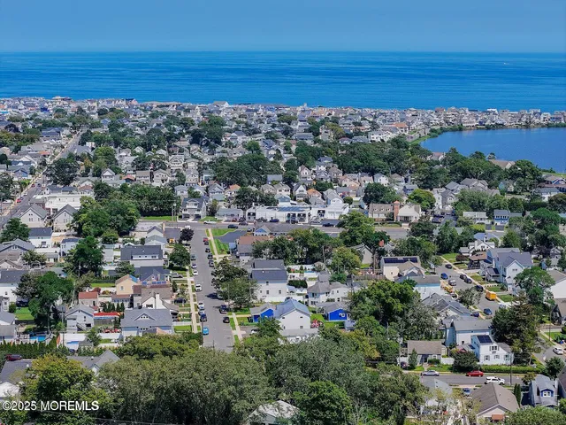 an aerial view of a city and ocean view